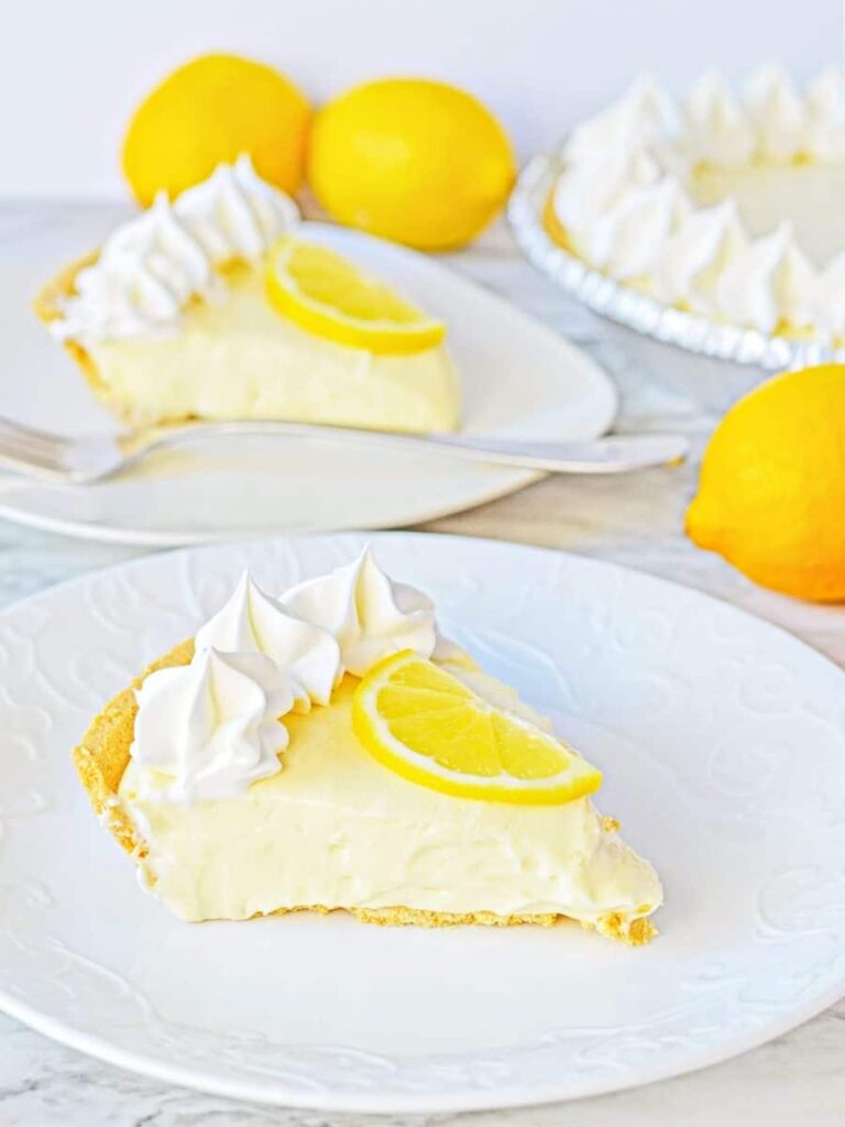 no-bake-lemon-cheesecake-slices-on-plates-900x1200.jpg