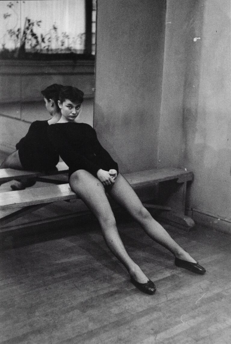 Audrey-Hepburn-resting-after-ballet-class-by-Ben-Ross-1952